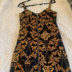 Topshop dress black with gold designs. Never worn. New without tag!